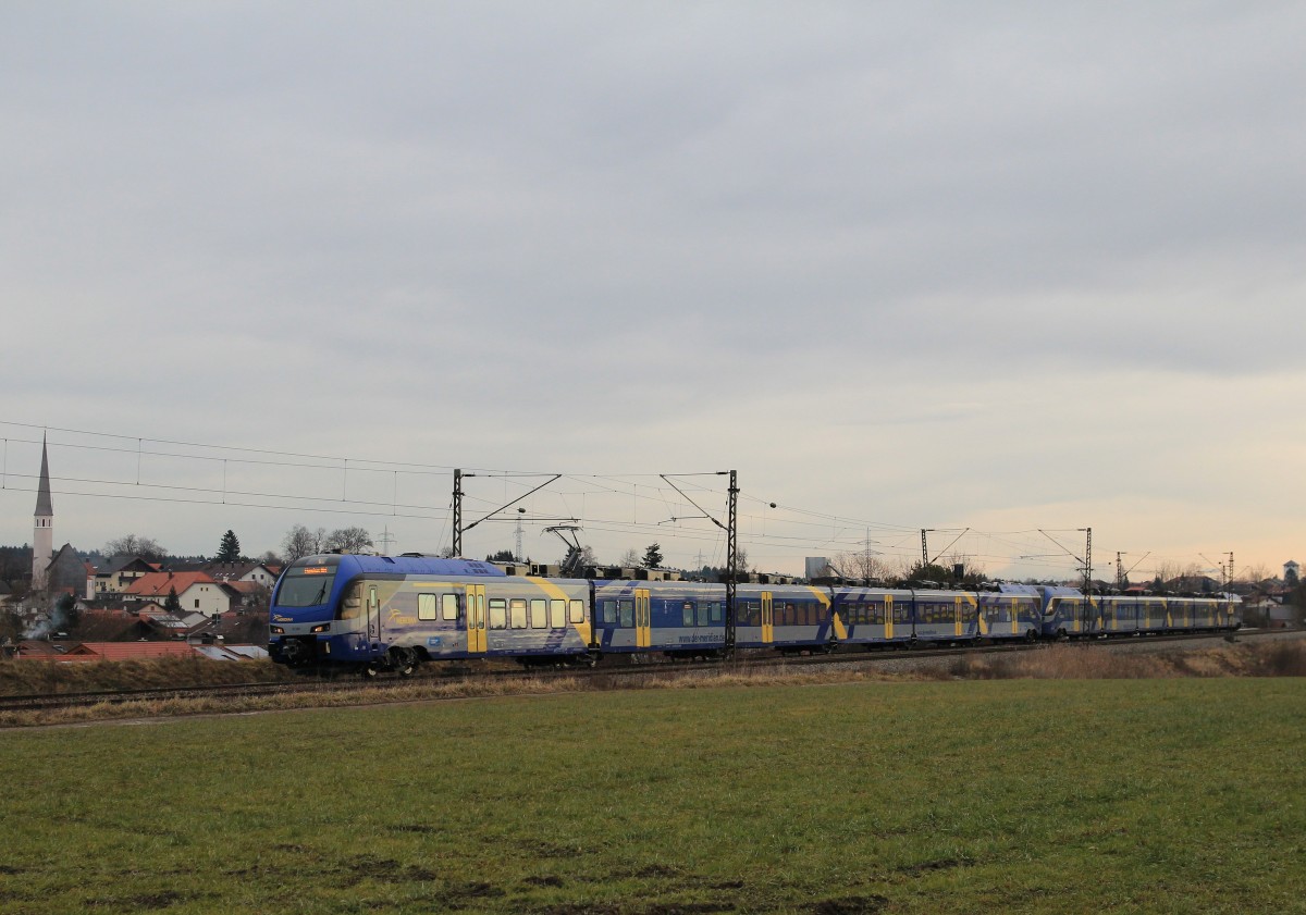 ET 320 ist am 4. Januar 2014 bei Osterm�nchen in Richtung M�nchen unterwegs.